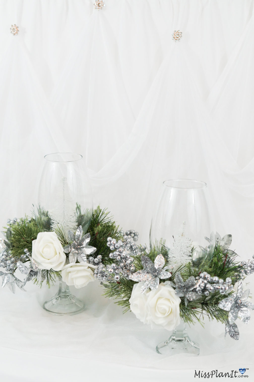 Festive Christmas centerpieces arrangement with candles, ornaments, and greenery
